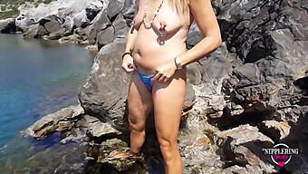 Horny Milf With Extreme Piercings Swims Nude At Public Beach